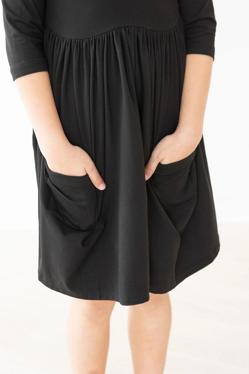 BLACK POCKET TWIRL DRESS